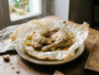 Guinea fowl thighs with mustard in parchment paper